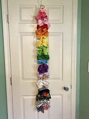 Rainbow assortment of bows with strong clips (includes leather strap holder)